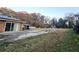 Spacious backyard with a patio, basketball hoop, swing set, and gazebo, perfect for outdoor entertaining at 1393 Bolton Nw Rd, Atlanta, GA 30331