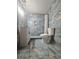 Modern bathroom with blue tile, a white vanity, and a shower with a glass door at 1393 Bolton Nw Rd, Atlanta, GA 30331