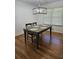 Dining room with hardwood floors, a gray wooden table, and black chairs at 1393 Bolton Nw Rd, Atlanta, GA 30331