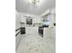 White kitchen with stainless steel appliances, marble countertops, and white cabinets at 1393 Bolton Nw Rd, Atlanta, GA 30331