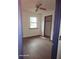 Empty bedroom with wood-look flooring, window, and closet at 4350 Lincolndale Dr, Ellenwood, GA 30294