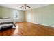 Charming bedroom with hardwood floors, ceiling fan, and plenty of space at 6214 Hagin St, Douglasville, GA 30134