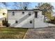 Side view of a white house with a brick foundation, windows, and a grassy yard at 1147 Graymont Sw Dr, Atlanta, GA 30310