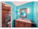 Bathroom with teal walls, granite countertop vanity, and walk-in shower at 1769 Cord Ct, Tucker, GA 30084