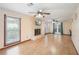 Living room featuring wood floors, a stone fireplace, and ample natural light at 1769 Cord Ct, Tucker, GA 30084