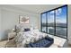 Spacious main bedroom with large windows offering stunning city views and stylish decor at 2425 Peachtree Ne Rd # 510, Atlanta, GA 30305