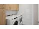 Dedicated laundry area with Whirlpool washer and dryer, ample storage, and modern cabinetry at 2425 Peachtree Ne Rd # 510, Atlanta, GA 30305