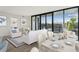 Bright, open living room with city views, modern furniture, and a dining area at 2425 Peachtree Ne Rd # 510, Atlanta, GA 30305