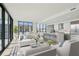 Open concept living area with large windows, modern kitchen, and island seating at 2425 Peachtree Ne Rd # 510, Atlanta, GA 30305