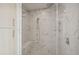 Luxurious walk-in shower with marble tile, rainfall showerhead, and built-in bench at 2425 Peachtree Ne Rd # 510, Atlanta, GA 30305