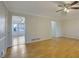 Bright living room with hardwood floors and views into the sunroom at 1312 Poplar Pointe Se, Smyrna, GA 30082