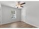 Bedroom featuring wood-look flooring, ceiling fan, and window at 7266 Crestside Dr, Austell, GA 30168