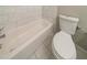 Bathroom with a bathtub, toilet, and tiled floor at 3930 Wedgefield Cir, Decatur, GA 30035