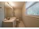 Clean bathroom with vanity, toilet, and window at 3930 Wedgefield Cir, Decatur, GA 30035