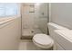 Compact bathroom with shower, toilet, and window at 3930 Wedgefield Cir, Decatur, GA 30035