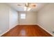 Large bedroom with ceiling fan, hardwood floors, and closet at 3930 Wedgefield Cir, Decatur, GA 30035