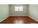 Bedroom with wood-look flooring and neutral-colored walls at 3930 Wedgefield Cir, Decatur, GA 30035