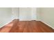 Spacious bedroom with hardwood floors, two doors, and ample natural light at 3930 Wedgefield Cir, Decatur, GA 30035