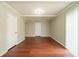 Spacious bonus room with wood-look floors, closet, and sliding glass door at 3930 Wedgefield Cir, Decatur, GA 30035