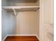 Empty closet with built-in shelving and hardwood floors at 3930 Wedgefield Cir, Decatur, GA 30035