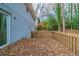 Deck overlooking a wooded backyard with fall leaves at 3930 Wedgefield Cir, Decatur, GA 30035