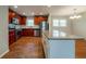 Updated kitchen featuring stainless steel appliances, wood cabinets, granite countertops, and an island at 3930 Wedgefield Cir, Decatur, GA 30035