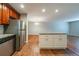 Modern kitchen with white cabinets, stainless steel appliances, and a granite countertop island at 3930 Wedgefield Cir, Decatur, GA 30035