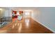 Spacious living area with hardwood floors, connected to the kitchen and dining space at 3930 Wedgefield Cir, Decatur, GA 30035