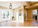 Bright dining area with French doors to the backyard, hardwood floors, and open access to the kitchen at 681 Farrar Ct, Decatur, GA 30032