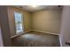 Spacious bedroom with carpet flooring, large window and deck access at 3419 Wesley Chapel Rd, Decatur, GA 30034