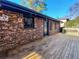 Backyard deck with string lights and access to a screened-in porch at 2691 Millwood Ct, Decatur, GA 30033