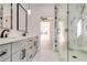 Modern bathroom with dual vanity sinks, marble shower, and stylish fixtures at 824 Braselton Hwy, Lawrenceville, GA 30043