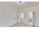 Bright bedroom with light hardwood floors, white walls, and ensuite bathroom at 824 Braselton Hwy, Lawrenceville, GA 30043