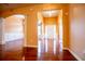 View of the entryway and dining area with hardwood floors and columns at 3680 Long Lake Dr, Douglasville, GA 30135