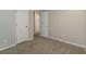 Well-lit bedroom with carpet flooring and doors at 4065 Bent Oak Ct, Douglasville, GA 30135