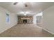 Living room with stone fireplace, ceiling fan and carpet flooring at 4065 Bent Oak Ct, Douglasville, GA 30135