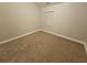 Spacious bedroom with plush carpeting and neutral walls at 1225 St James Pl, Loganville, GA 30052