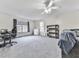 Bright bedroom with grey carpet and built-in shelving at 141 Timberland Dr, Canton, GA 30114