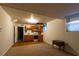 Basement area with kitchenette, tiled and carpeted floors, and drop ceiling at 750 Mount Vernon Hwy, Atlanta, GA 30327