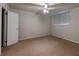 Carpeted basement bedroom with ceiling fan and window at 750 Mount Vernon Hwy, Atlanta, GA 30327