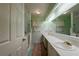 Bathroom featuring dual vanities, built-in tub, and tiled floors at 750 Mount Vernon Hwy, Atlanta, GA 30327
