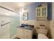 Modern bathroom with glass shower, white vanity, and tile walls at 750 Mount Vernon Hwy, Atlanta, GA 30327