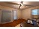 Bedroom with ceiling fan, wallpapered walls, and hardwood floors at 750 Mount Vernon Hwy, Atlanta, GA 30327