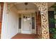 Front porch with decorative metal railings and glass front door at 750 Mount Vernon Hwy, Atlanta, GA 30327