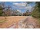 Single-story home with driveway, front yard, and trees at 750 Mount Vernon Hwy, Atlanta, GA 30327