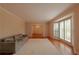 Living room with hardwood floors, large window, and view into the dining room at 750 Mount Vernon Hwy, Atlanta, GA 30327