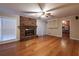 Living room with fireplace, hardwood floors, and a view of the kitchen at 750 Mount Vernon Hwy, Atlanta, GA 30327