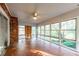 Sunroom with tiled floors, large windows, and a brick accent wall at 750 Mount Vernon Hwy, Atlanta, GA 30327