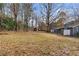 Spacious backyard with trees and a storage shed at 2960 Valley Ne Ct, Conyers, GA 30012