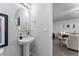 Powder room with pedestal sink and oval mirror at 3178 Cedar Crest Way, Decatur, GA 30034